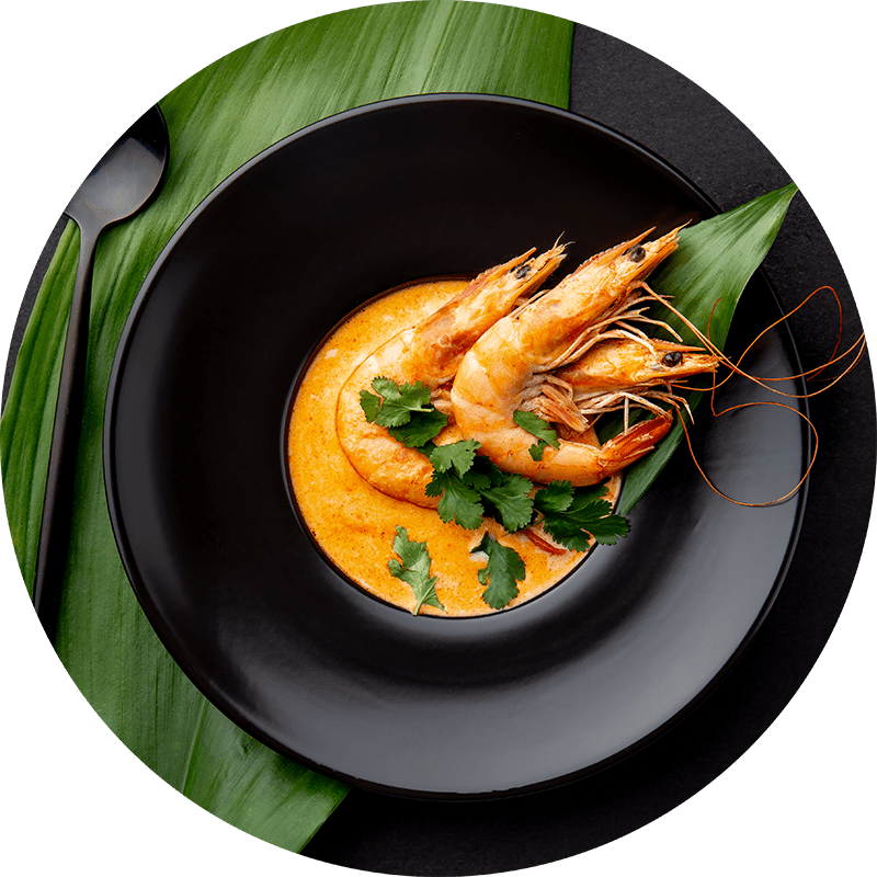 seafood-soup-decorated-with-whole-shrimps-and-A9WD43P-min.png